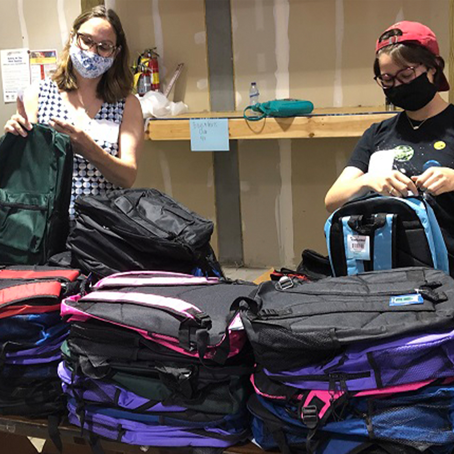 10-helpers Helpers pack bookbags for back-to-school