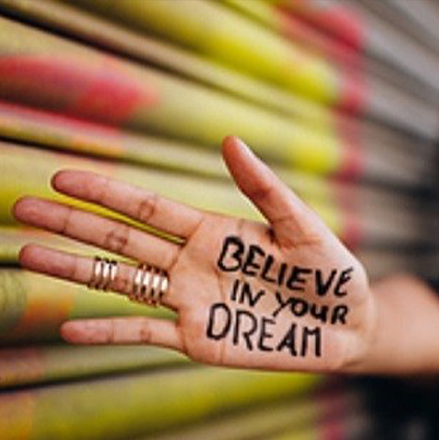 Org Hand with the words Believe in your dream written on it