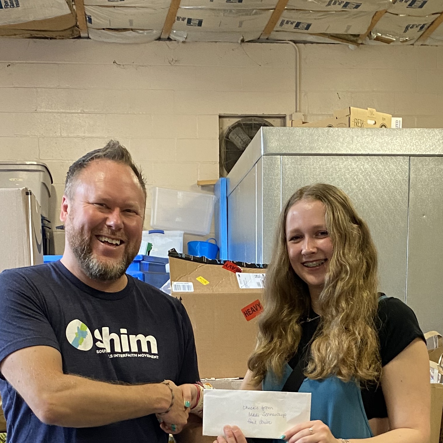 Donation drive host Madi with Seth at SHIM