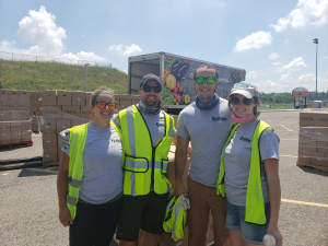 Volunteers in front of food bank truck