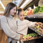 Woman with girl at grocery store