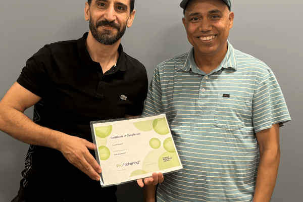 Youssef with ProFathering certificate and teacher Netra