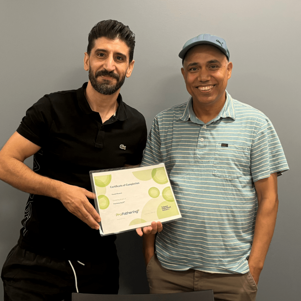 Youssef with ProFathering certificate and teacher Netra